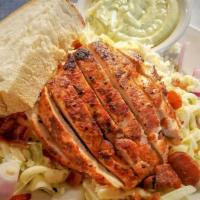 Grilled Cajun Chicken Salad · Cajun spiced chicken breast on tossed lettuce with bacon, red onion, tomato, cucumber, Jack ...
