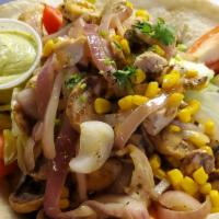 Southwestern Chicken Salad · Chicken, mushroom, corn, red onion on a flour tortilla w/black beans. shredded lettuce, toma...