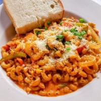 Creole Macaroni · Chicken, cajun sausage, peppers, onions, tomatoes, and corn tossed in a cajun cream sauce. S...