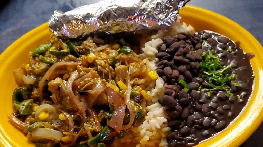 Roast Pork · shredded with salsa verde, red onions, corn, and peppers served with rice, black beans and corn tortillas.