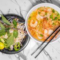 Mì Nước Thập Cẩm / Egg Noodle Soup · Red roast pork, fish balls, crab meat, shrimp (2 pieces), and squid.