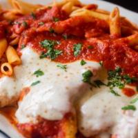 Veal Parmigiana · Lightly breaded and baked with mozzarella, parmesan, marinara and served with a side of penn...