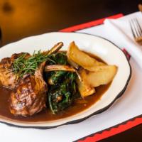 Double Cut Lamb Chops · Two rib chops broiled with lemon and oregano, served with sauteed spinach and roasted potato...