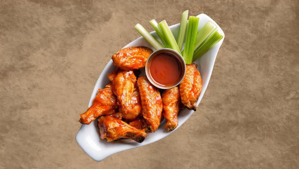 Buffalo Wings (7 Pcs) · Classic buffalo-style chicken wings served with celery sticks and dressing.