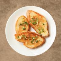 Garlic Bread · Italian bread toasted in Ranchito's famous garlic-herb butter.