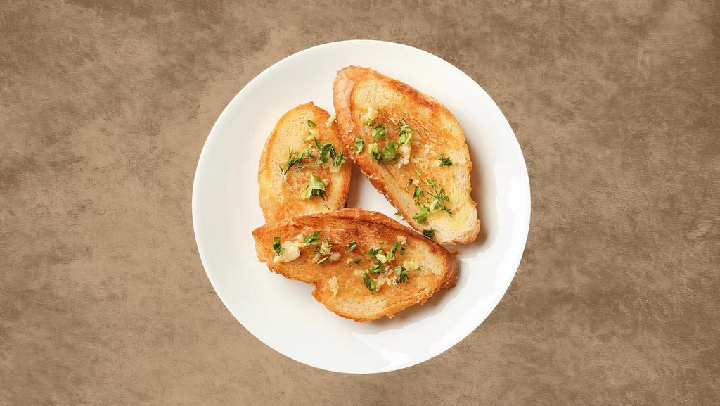 Garlic Bread · Italian bread toasted in Ranchito's famous garlic-herb butter.