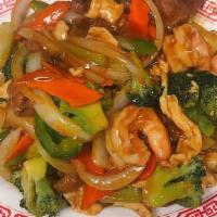 Happy Family · The combination of chicken, beef, shrimp cooked with broccoli, snow pea, carrot, mushroom, w...