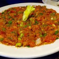 Tomato Kibbee · Vegan. A flavorful mix of tomatoes, cracked wheat, onions and seasonings.