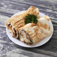 Chicken Shawarma Sandwich · Slow roasted and shaved dark chicken meat with garlic sauce and pickles.