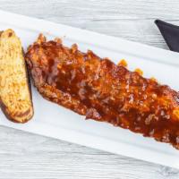 Full Slab Rib Dinner · Tender pork baby back ribs, meaty and broiled to perfection. Includes freshly made coleslaw ...