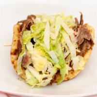 Gyro · Served with creamy garlic sauce or cucumber sauce, lettuce, tomatoes, and onions.