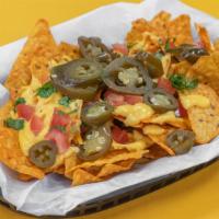 Crazy Nachos · Doritos,cueritos,nacho cheese,tomatoes,cilantro and jalapeños