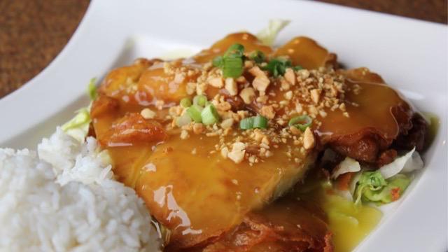 Wor Sue Gai  - Sp · A classic Cantonese recipe of battered and fried chicken breast topped with peanuts and green onions in our special  yellow sauce.