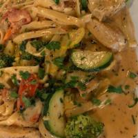 Pasta Primavera · Fresh mixed vegetables in cream sauce with a touch of marinara served over fettuccine.