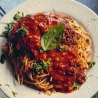 Spaghetti Carbonara · Sautéed tomatoes, mushrooms, ham in a white wine cream sauce with a touch of marinara over h...
