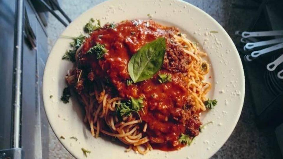 Spaghetti Carbonara · Sautéed tomatoes, mushrooms, ham in a white wine cream sauce with a touch of marinara over homemade spaghetti pasta.