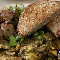 Pesto Scrambler · Housemade pesto mixed with your choice of eggs or tofu, served with breakfast potatoes and c...