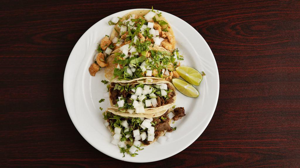Tacos · Double corn soft tortilla with your choice of meat. comes with cilantro and onion to the side salsa and lime. flour tortilla extra salsa and extra lime.
