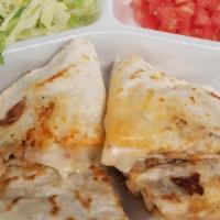Quesadilla Chica · Any kind of meat with cheese -montrerey jack, tomatoes, lettuce, and sour cream.