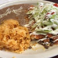 Enchiladas · Three corn tortillas rolled and filled with choice of chicken, chorizo, ground beef or chees...