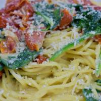 Florentine · Spinach, garlic and tomatoes sautéed in white wine cream sauce over spaghetti noodles