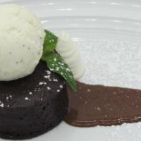 Warm Chocolate Cake · White chocolate whipped cream and Johnson's vanilla bean ice cream.