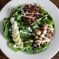 Detroit · Baby spinach, roasted button mushrooms, bacon, sliced egg, and chunky Bleu cheese dressing.