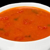 Mulligatawny Soup · Yellow lentils cooked with mild spices.