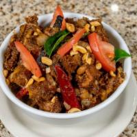 Goat Pepper Fry · Goat meat (bone-in) cooked with special Indian spices and pepper.
