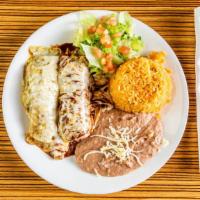 Enchiladas Suizas · Corn tortillas stuffed with your choice of chicken, steak or cheese smothered with a mild mo...