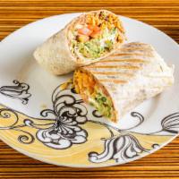 Burrito Vegetariano · Filled with beans, rice, cheese, guacamole, onions, sour cream, cilantro, lettuce, and tomat...
