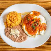 Huevos Rancheros · Sunny-side up on a flat tortilla with homemade ranchero sauce.