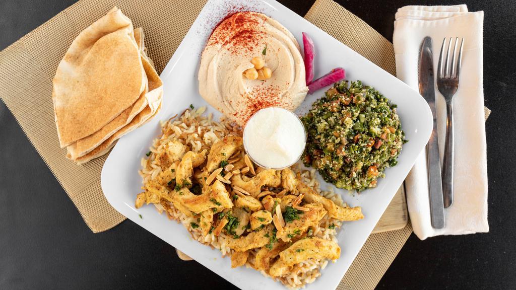 Chicken Shawarma Plate
 · Includes hummus, rice with almonds, tabouli or fattoush, bread and side of garlic or tahini.