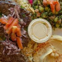 Kafta Kabob Plate
 · Includes hummus, rice with almonds, tabouli or fattoush, bread and side of garlic or tahini.