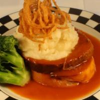 Kid'S Famous Meatloaf · Buttermilk-chive mashed potatoes, wild mushrooms, broccoli, chili onion rings, and BBQ gravy...