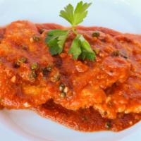 Scaloppina Di Vitello Pizzaiola · Veal scaloppina sauteed in EVOO, garlic, fresh tomato sauce, white wine and capers.