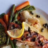 Piccata Di Salmon · Grilled Ora King Salmon with white wine, lemon and capers. Served with steamed vegetables an...