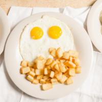 Country Fried Steak Breakfast · Two Eggs, country fried steak smothered in gravy.