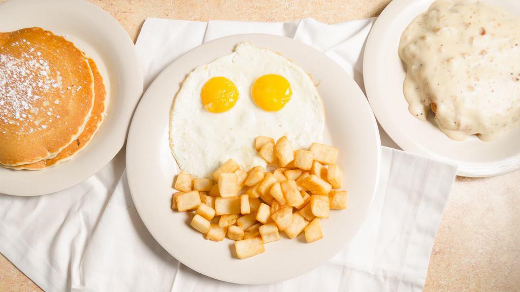 Country Fried Steak Breakfast · Two Eggs, country fried steak smothered in gravy.