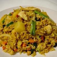 Pineapple Fried Rice · Stir-fried rice with egg, onion, carrots, raisins, and pineapple in our homemade sauce with ...