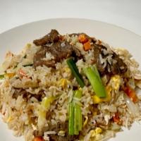 Thai Fried Rice · Stir-fried rice with egg, bell pepper, onion, green onion, and carrots in our homemade sauce