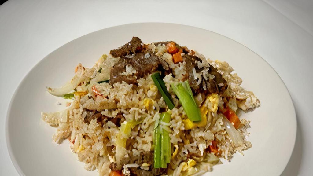 Thai Fried Rice · Stir-fried rice with egg, bell pepper, onion, green onion, and carrots in our homemade sauce