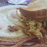Breakfast Sandwich · Served with hash browns, one egg with bacon or sausage and cheese, served on an English muff...
