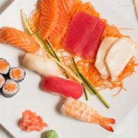 Sushi & Sashimi Combo · Six pieces sushi, nine pieces sashimi and spicy tuna roll. Includes soup and salad.
