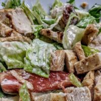 Chicken Caesar Salad · Grilled chicken, crispy romaine lettuce, Caesar dressing, croutons, tomatoes, and cucumbers....