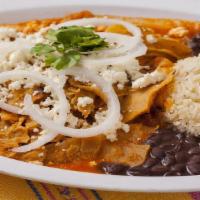 Chilaquiles Con Carne · Fried tortilla chips with green or red sauce on top. Served with cheese, sour cream, and you...