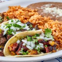 Taco Dinner · Three tacos with your choice of up to two different meats topped with cilantro and onions. S...