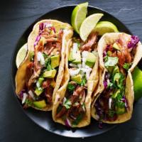 Carnitas Tacos · Three fried pork tacos with cilantro and onions. Served with a side of red spicy salsa.
