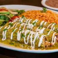 Enchiladas · Three fried roll tacos topped with cheese and sour cream and covered with your choice of spi...