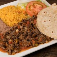Bistec A La Mexicana · Sauteed skirt steak with tomatoes, onions, jalapenos, and cilantro. Served with rice, beans,...